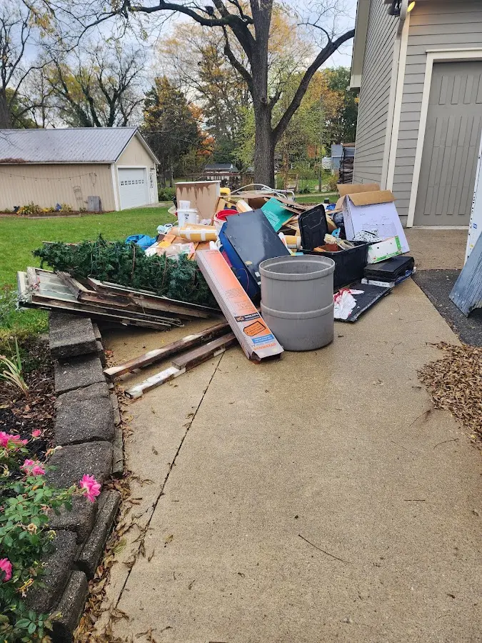 Dumpster being loaded with debris for 3 Yard Dumpster Rental in Indiantown